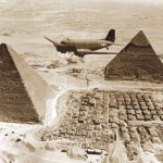 American transport plane flying over the pyramids of Egypt