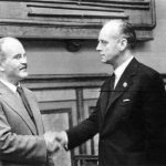 V. Molotov and I. von Ribbentrop shake hands after signing the pact.