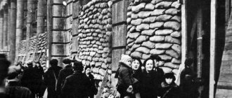 Residents on the street of besieged Leningrad near buildings
